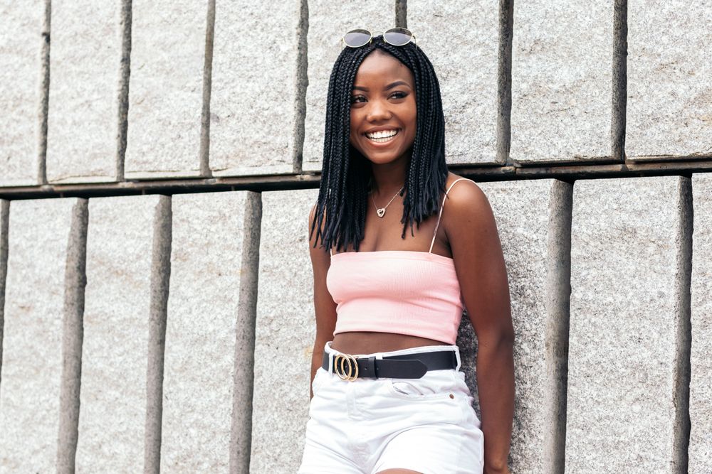Portrait of a Black young woman enjoying in the city