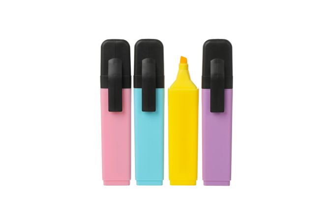 Different color highlighters isolated on blank background