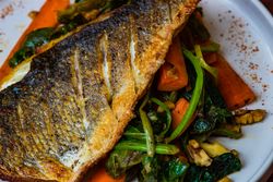 Top view of grilled salmon fish and vegetable