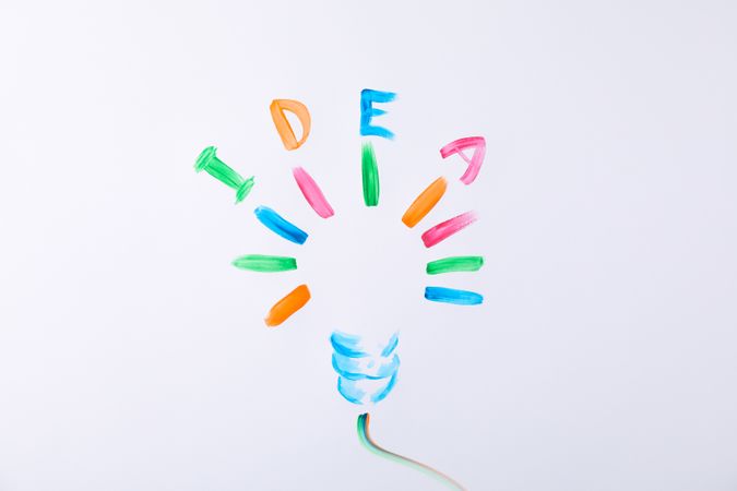 Drawn light bulb and inscription Idea on blank background, space for text