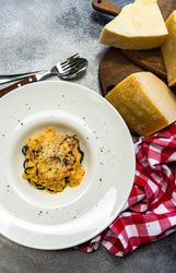 Top view of Italian homemade pasta with parmesan