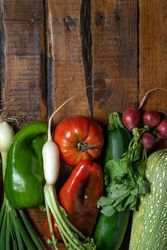 Fresh vegetables on plank wooden table