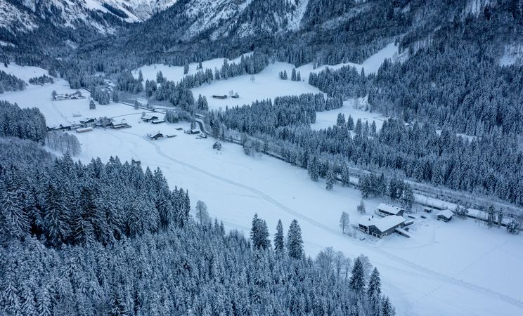 Snow covered valley in December, drone aerial view in the Bavarian Alps, Germany