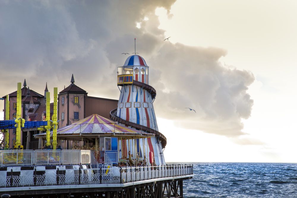 Amusement park on pier in evening