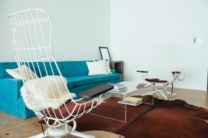 Wire patio chairs inside bright living room