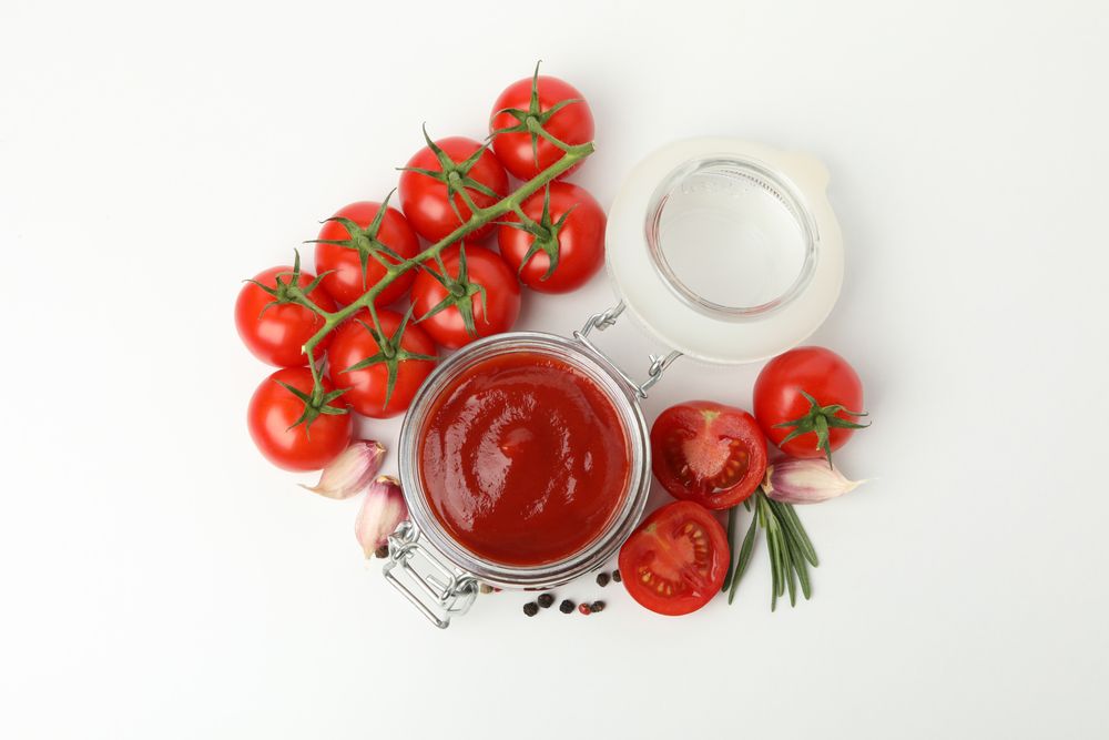 Tomatoes, sauce and ingredients isolated on neutral background
