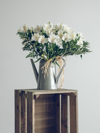 Bouquet of flowers in watering can
