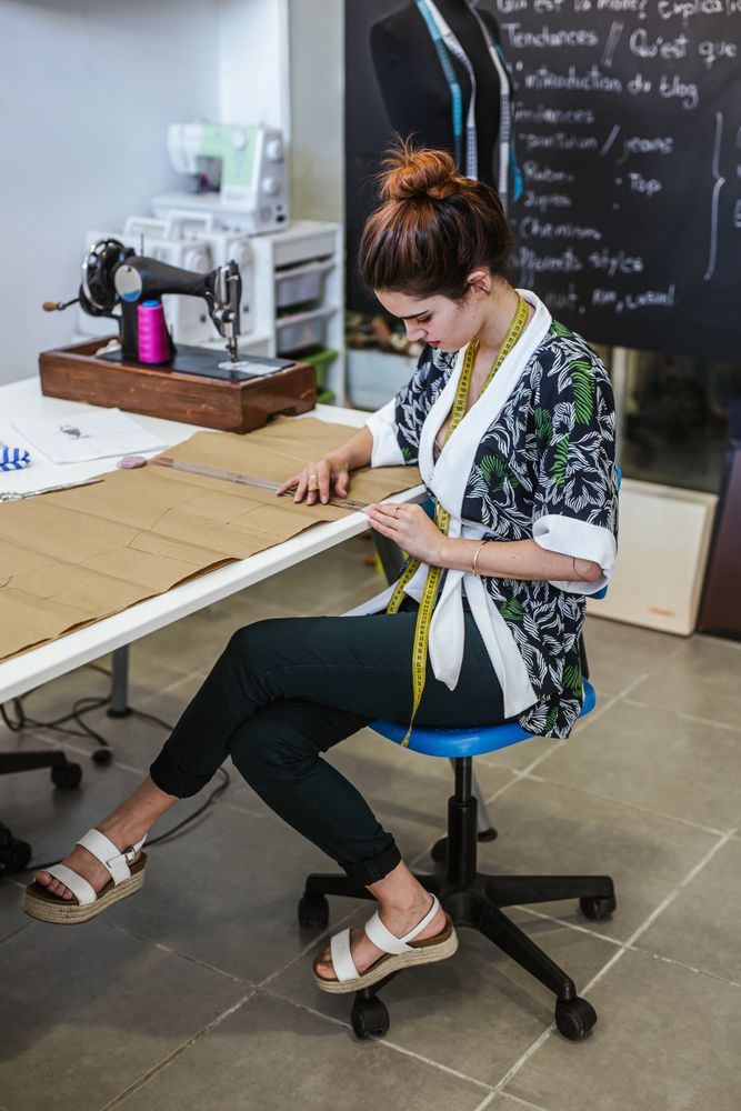 Woman in a sewing school