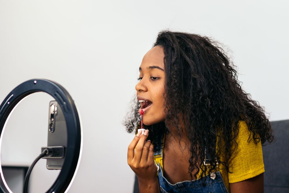 Beauty blogger promoting makeup on social media