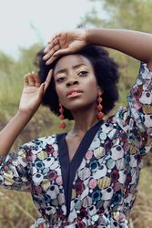 Portrait of Black woman in colorful shirt outdoor