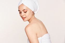 female with radiant body after cosmetic procedure