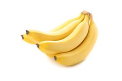 Banana cluster isolated on light background. Fresh fruit