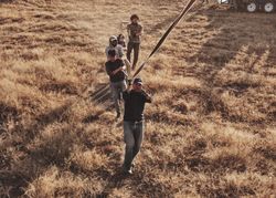 Group of people roping in hot air balloon