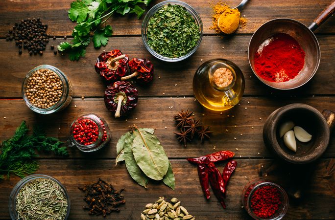 Spices and oil on table