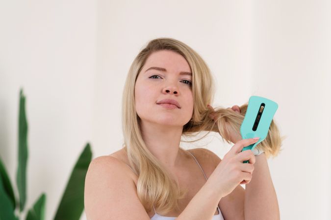 Hair brushing as part of morning routine.