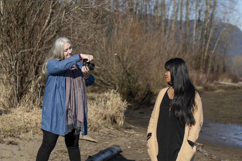 Woman photographing another female