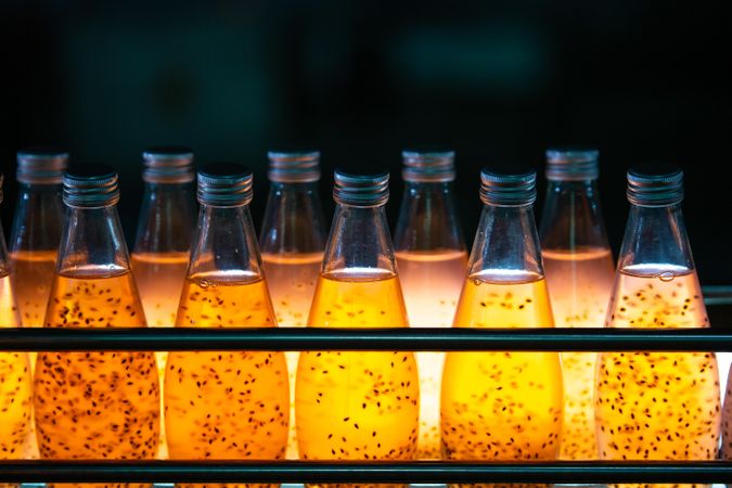 Orange fruit juice in clear bottles