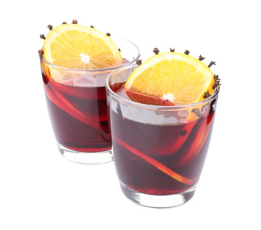Glasses of tasty mulled wine with orange isolated on blank background