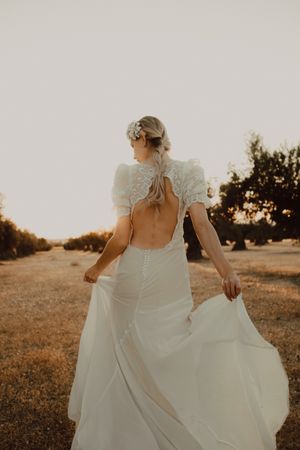 Woman in dress posing on nature