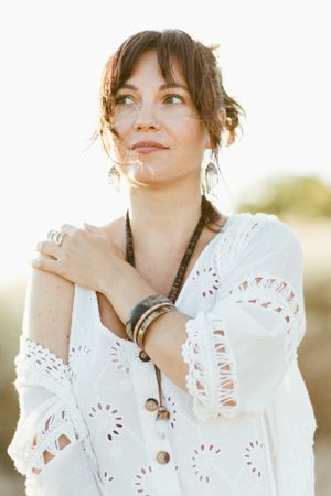 Charming smiling woman with trendy accessories outdoors