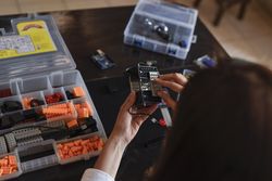 Woman assembling a robot