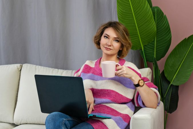 Woman Freelancer Using Laptop Working From Home With Coffee