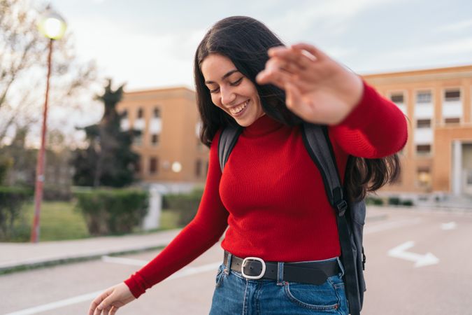 student woman portrait smiling and covering her face with her hand