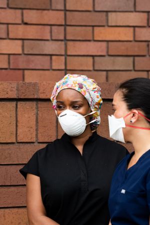 Two women friend nurses on break outside together
