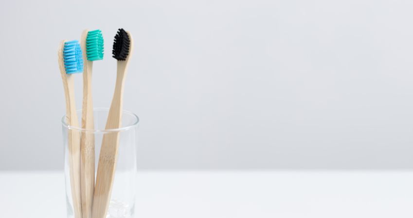 Bamboo toothbrushes in glass holder