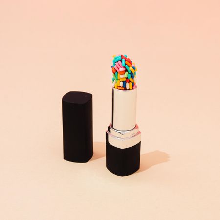 Open lipstick with cake sprinkles