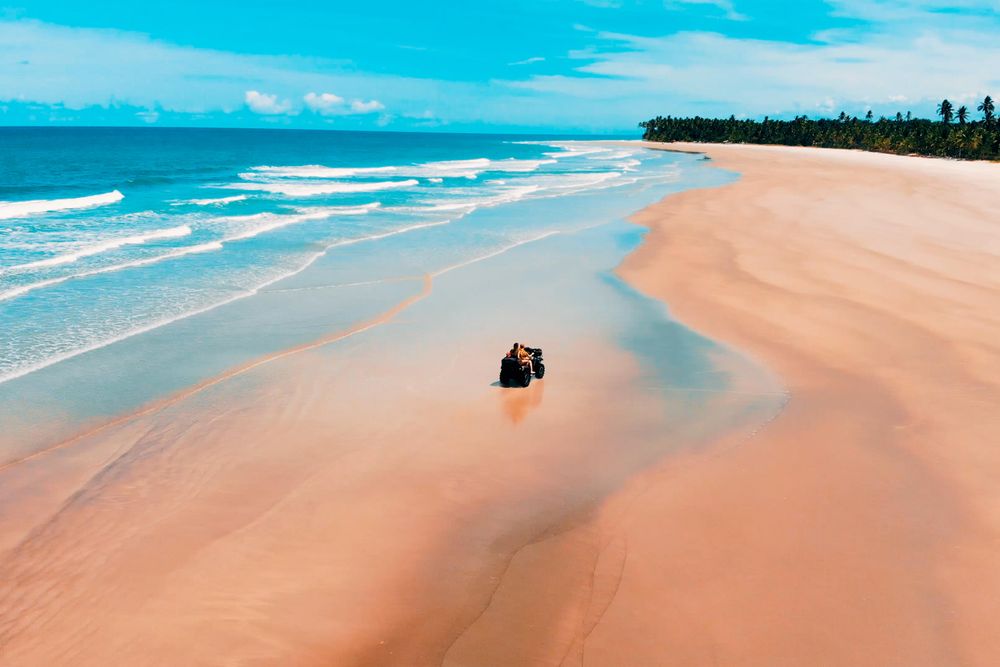 ATV on sandy seashore during daytime