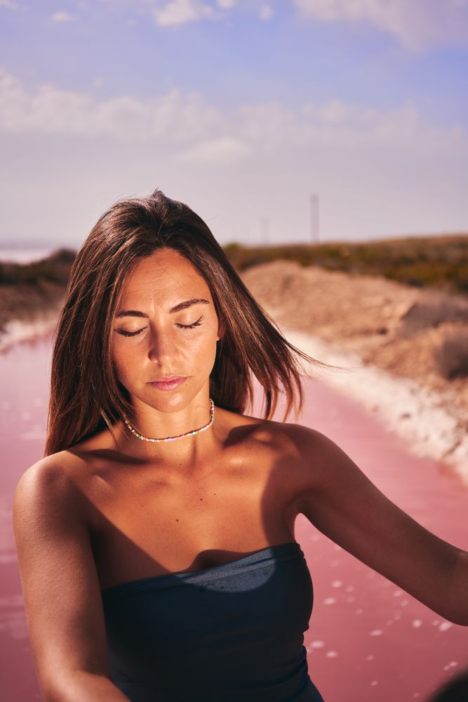 Bronzed female in swimsuit in sunlight