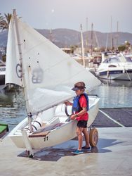 Boy preparing boat for sailing