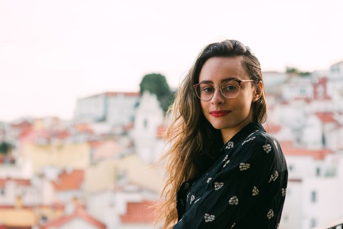Casual woman against cityscape