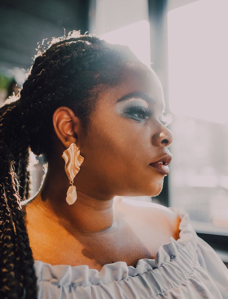 Headshot of confident trendy Black woman