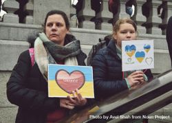London, England, United Kingdom - March 5 2022: Two female holding heart sign with Ukrainian flag 49ONv0