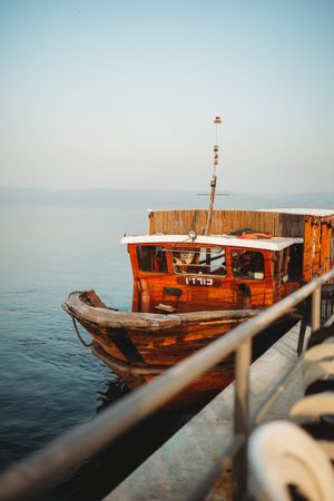Old boat near metal pier