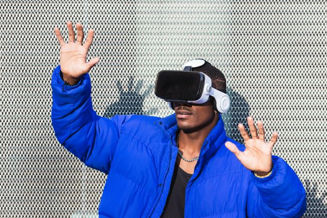 Black man experiencing virtual reality in city