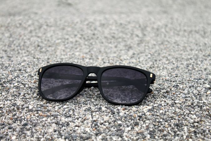 Sunglasses sitting on grey surface