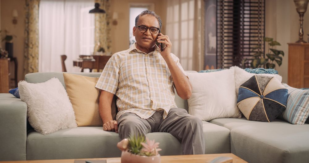 Mature Indian Man Talking On His Smartphone