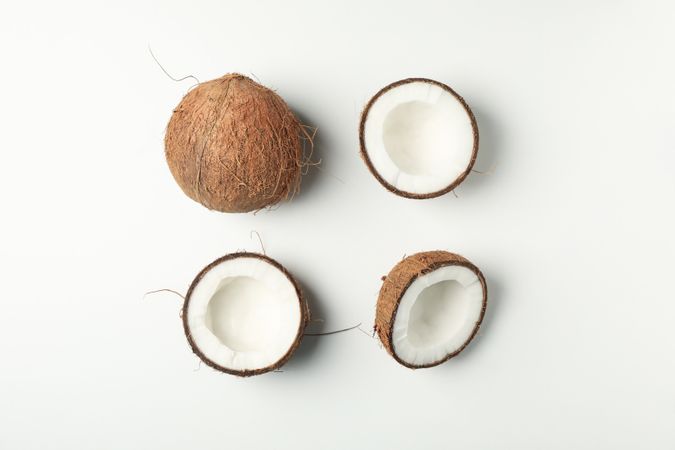 Flat lay with coconut on plain background, top view