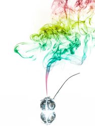 Jar with herbs emitting smoke