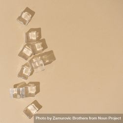 Flat lay of ice cubes on beige background with shadows 0WNwjb