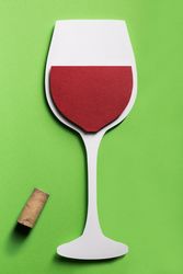 Silhouette of a glass of red wine made with cardboard