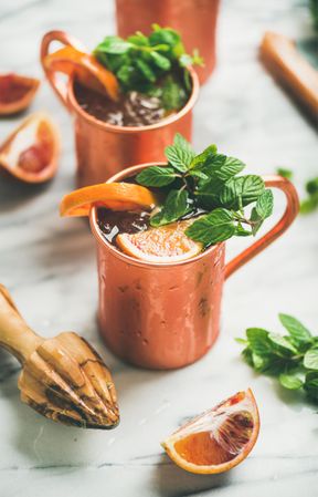 Close up of delicious summer or spring citrus Moscow mules in copper mugs