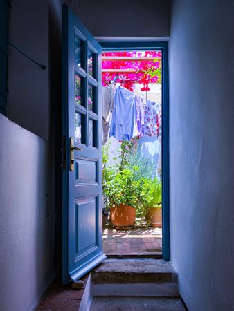 Patmian blue door to clothes line