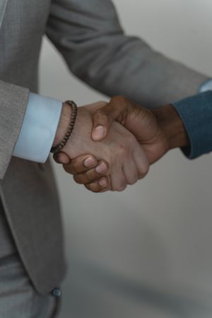 Close-up shot of two businessmen handshaking