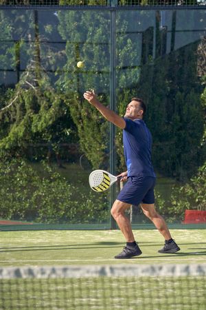 Man playing padel on court