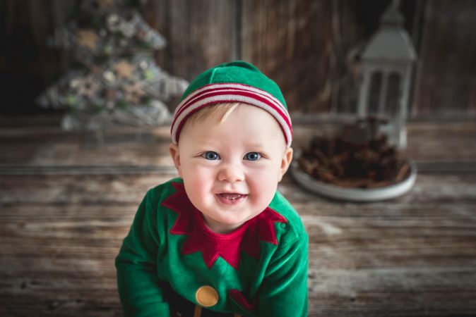 Baby boy wearing Christmas theme outfit smiling