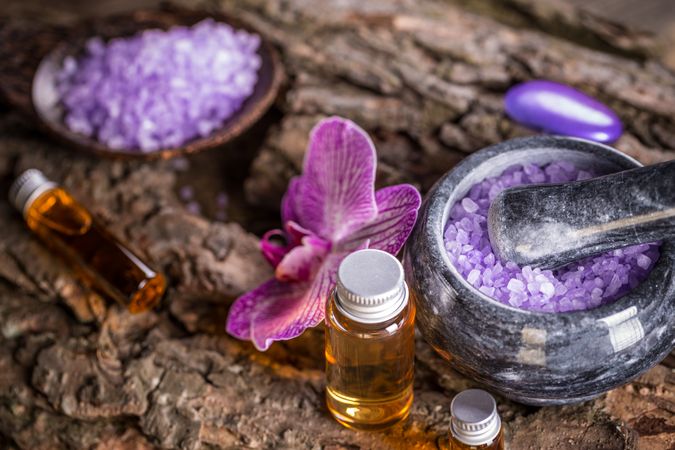 Beauty treatment concept of relaxing oils with floral bath salts